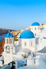 famous blue domes and volcano caldera with sea landscape, beautiful details of Oia and Santorini...