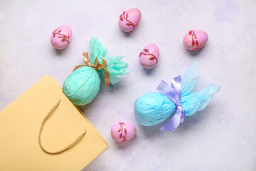 Shopping bag with Easter eggs on lilac grunge background