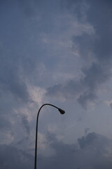 street lamp on blue cloudy sky background