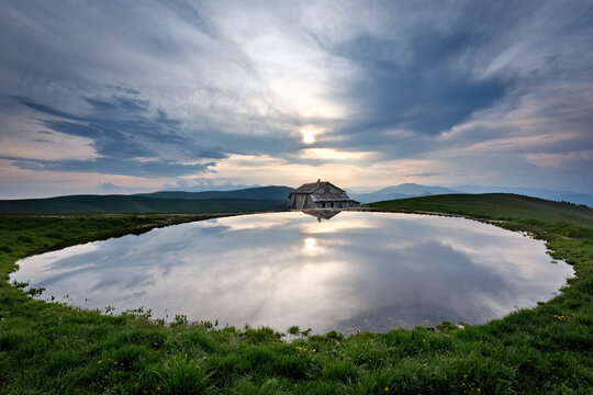 Water pool at Malga Gasparine among the pastures of Lessinia. Erbezzo, Veneto, Italy.