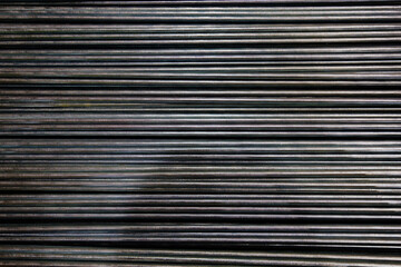 Group of threaded steel rods, abstract background