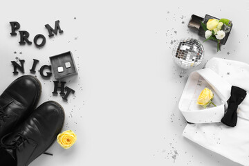 Words PROM NIGHT with male shoes, shirt and cufflinks on white background