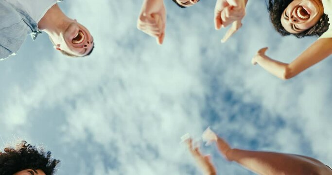 Sky, group of people and fist for team building, partnership and trust in teamwork mindset. Happy, friend and huddle of high five to bump, support and collaboration for diversity and inclusion