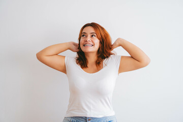 plus size red haired young latin woman happy with her arms in the air