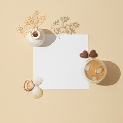 Creative trendy layout made with cup of coffee, chocolate hearts, sea shells, white vase with dry...