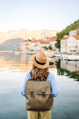 A woman tourist walks and enjoys the views and attractions. Travelling, lifestyle, adventure.