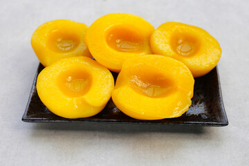 Peach halves in syrup. Fruity desserts