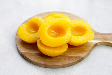 Peach halves in syrup. Fruity desserts