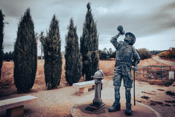 French Way of Saint James - monument to the pilgrim - statue of a pilgrim drinking water in San Justo de la Vega, province of Leon, Castile and Leon, Spain - 753294743