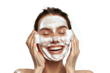 Portrait of cheerful laughing woman applying cleansing foam for washing face. 