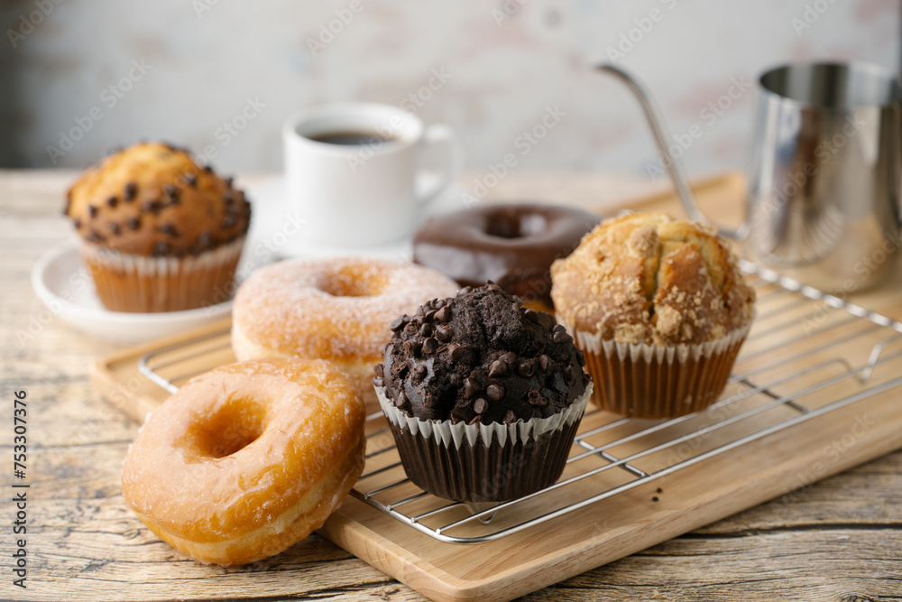 Sticker glazed donuts with coffee and muffins