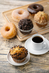 chocolate chip muffin with donut and coffee