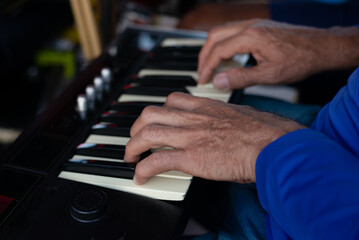 Keyboardist with hands making chords.