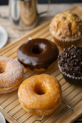 glazed donuts with coffee and muffins