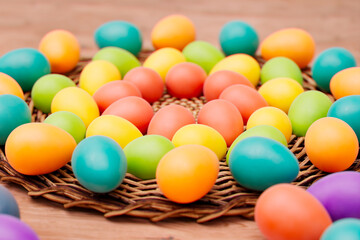 Fototapeta na wymiar Assorted Hand-Painted Easter Eggs Nestled in a Woven Basket