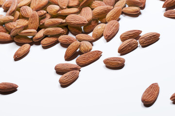 Nutritious Raw Almonds Evenly Dispersed on a Pristine White Surface