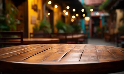 Fotobehang Acercamiento a una mesa rústica de madera vacía en un hermoso restaurante mexicano © adanzat
