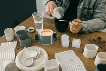 Master makes creative products from plaster and concrete, process