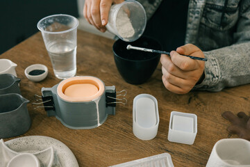 Master makes creative products from plaster and concrete, process