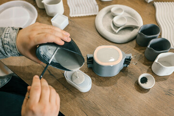 Master makes creative products from plaster and concrete, process