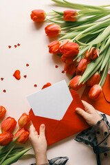 Girl holding an empty envelope with space for text, concept Happy Mother's Day, Happy Valentine's Day