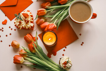 Candle and bouquet of red tulips, spring aesthetics