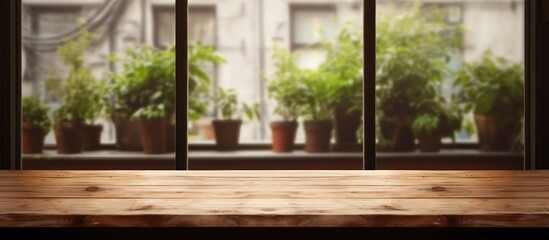 Fototapeta premium Empty wooden table for displaying your product against a softly focused cafe windows backdrop