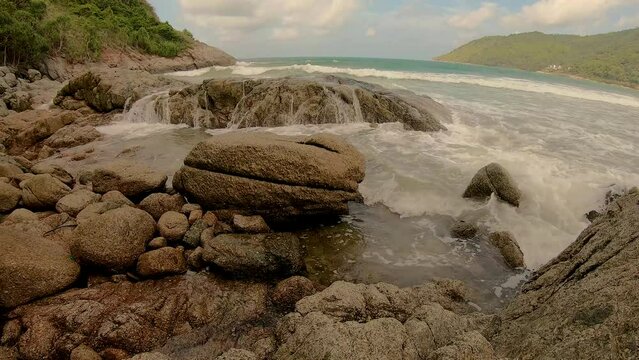 January 14, 2024 - Nai Harn, Phuket Thailand. The view from the rocks at the beach, one of the least known and most interesting places to sit.