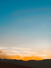 Beautiful sunset with orange sky and huge cloud seen from the Manrique neighborhood. Medellin, Antioquia, Colombia.