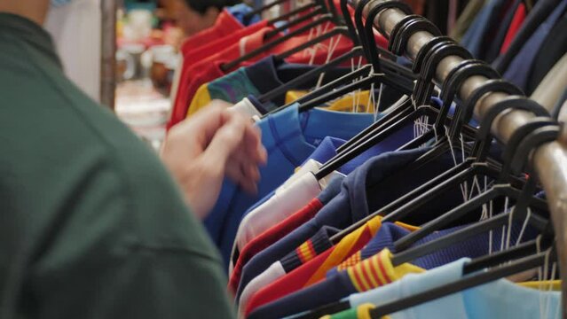 People buying used second hand clothes outdoor. Charity Shop and Garage Sale, Recycling Eco New Life, European Store. 