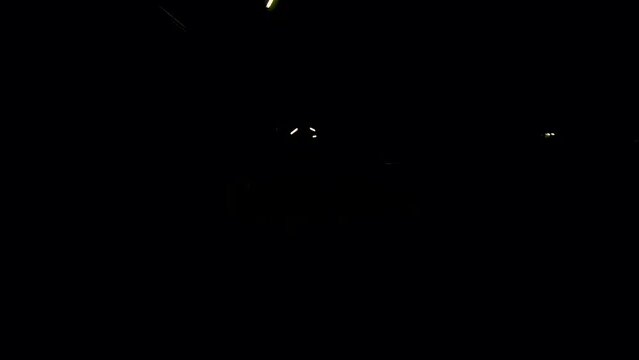 January 14, 2024 - Rawai, Phuket Thailand. Driving down a dimly lit road in Rawai at night.