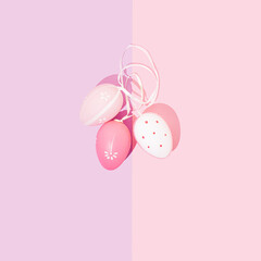 Beautiful pink and white Easter eggs on pastel background. Minimal Holiday concept. Copy space. Flat lay, Top view. Greeting card.
