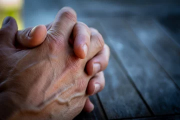 Mans hands together waiting