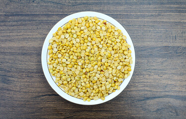 Toor dal or arhar dal in a plate on wooden background top view 