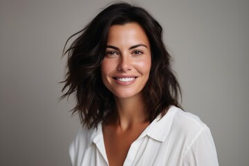 Portrait of a beautiful young woman smiling and looking at the camera
