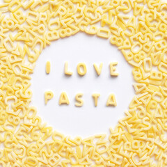 A sentence i love pasta in the centre surrounded by alphabet pasta