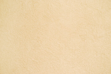 Beige plastered wall background, plastered texture