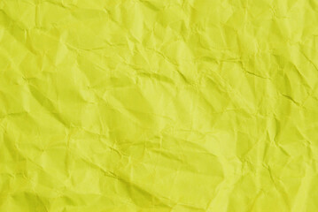 Obraz na płótnie Canvas A sheet of wrinkled glossy pistachio paper texture as background 