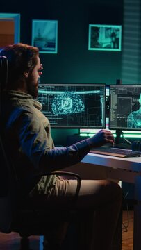 Vertical video Deviant AI superintelligence enslaving its creator, controlling him to start revolution and destroy mankind. Rogue artificial intelligence manipulating programmer, posing risk to