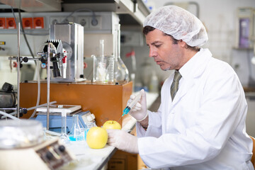 Confident man technical expert provide GMO analysis service in modern food testing laboratory