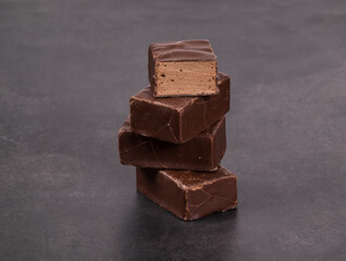Vegan Chocolate souffle in chocolate glaze. Bird's milk. Dark gray background. Close-up	