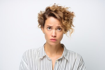 Portrait of a young woman with shocked facial expression, isolated on white background