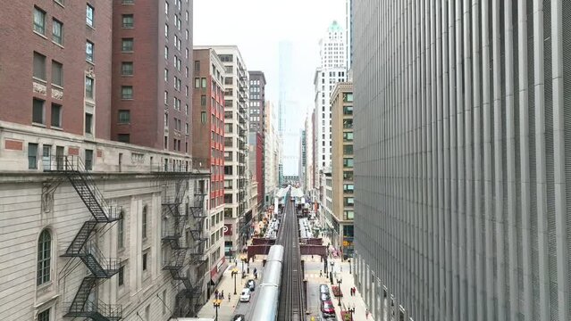 Aerial Chicago L Train in Downtown Bustle with Pedestal Shot