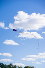 Background of a kite flying on the sky. Flying a kite is common outdoor activity during summer. Kids, adults or family member can play this sport together thanks to mild wind. Nice concept for hobby