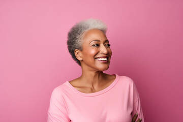 photo of aging woman smiling in front of pink background, women's health and beauty,