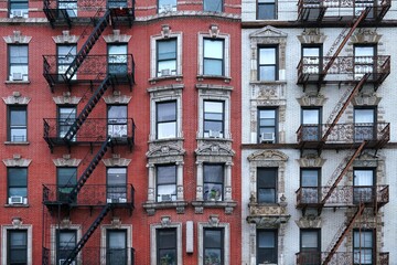New York City ornate old apartment buildings with external fire ladders - obrazy, fototapety, plakaty