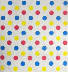 Dotted seamless patterned background. Fabric material with colorful dots on a white background.