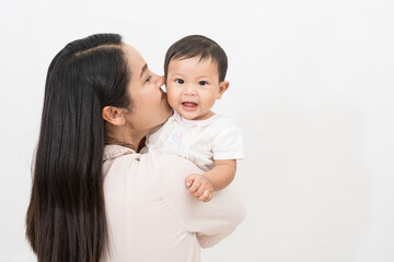 Asian mother raises her daughter with love and understanding about the child's development.