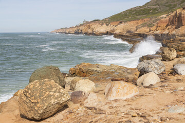 Waves breaking on cliffs, San Diego, California