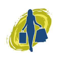 Silhouette of a slim young woman carrying shopping bags.